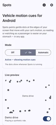 Spots home screen with motion cues switched on and a live preview of cue dots at the screen edges during a demo drive